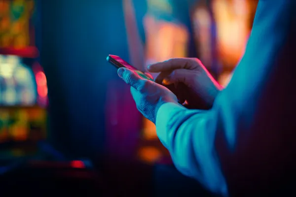 88DF — A high-class gaming experience without limits A woman in a luxurious green gown next to an ornate roulette wheel, capturing the upscale casino mood of 88DF.